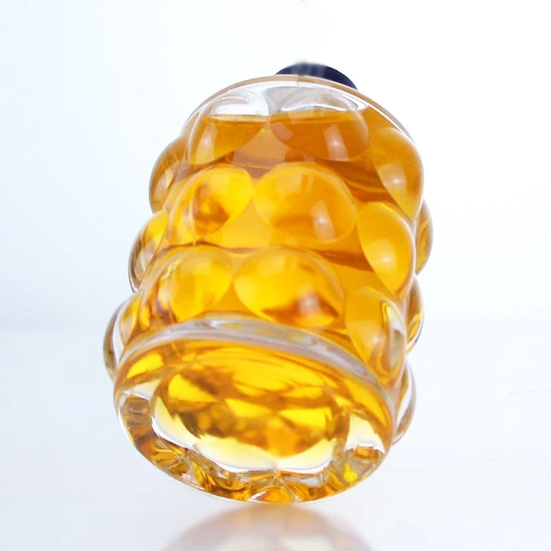 425-Small empty clear glass bottle with round bump