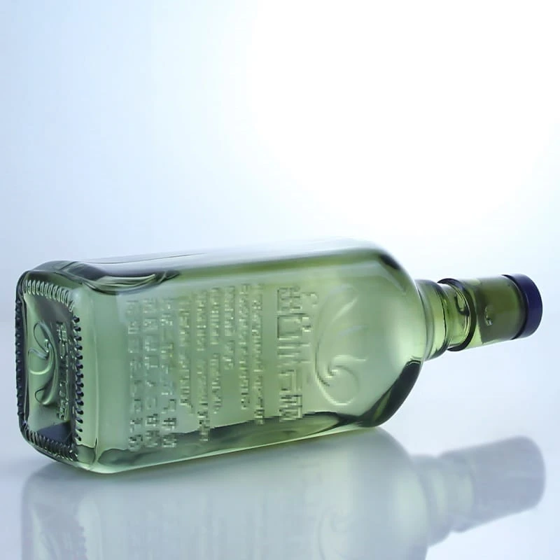 488-700ml light green embossed logo liquor bottle with swing cap