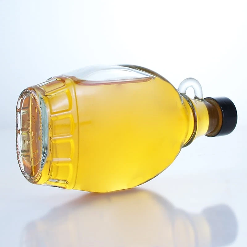 428-250ml empty glass bottle with a handle