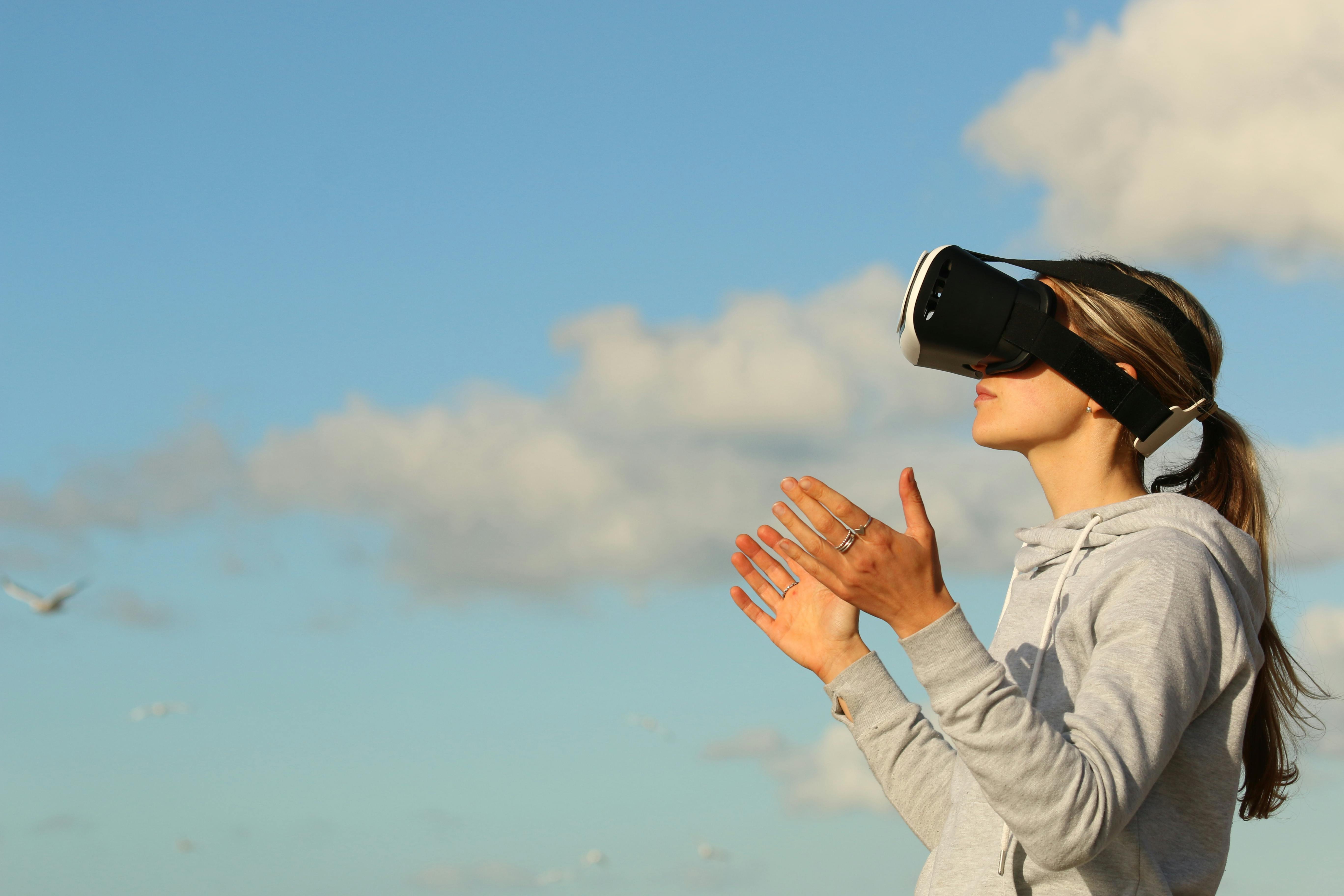 Person wearing a VR headset immersed in a digital environment